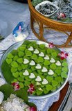 Khanom wun kati is a coconut jelly snack found at street stalls all over Thailand. The green colouring comes from using pandanusleaves.